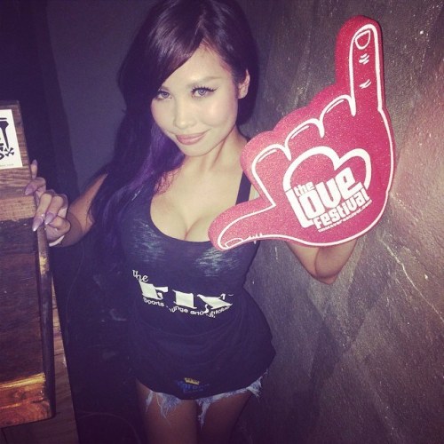 Model and Go Go Dancer Lauren La La displaying a Love Fest Hawaii shaka.